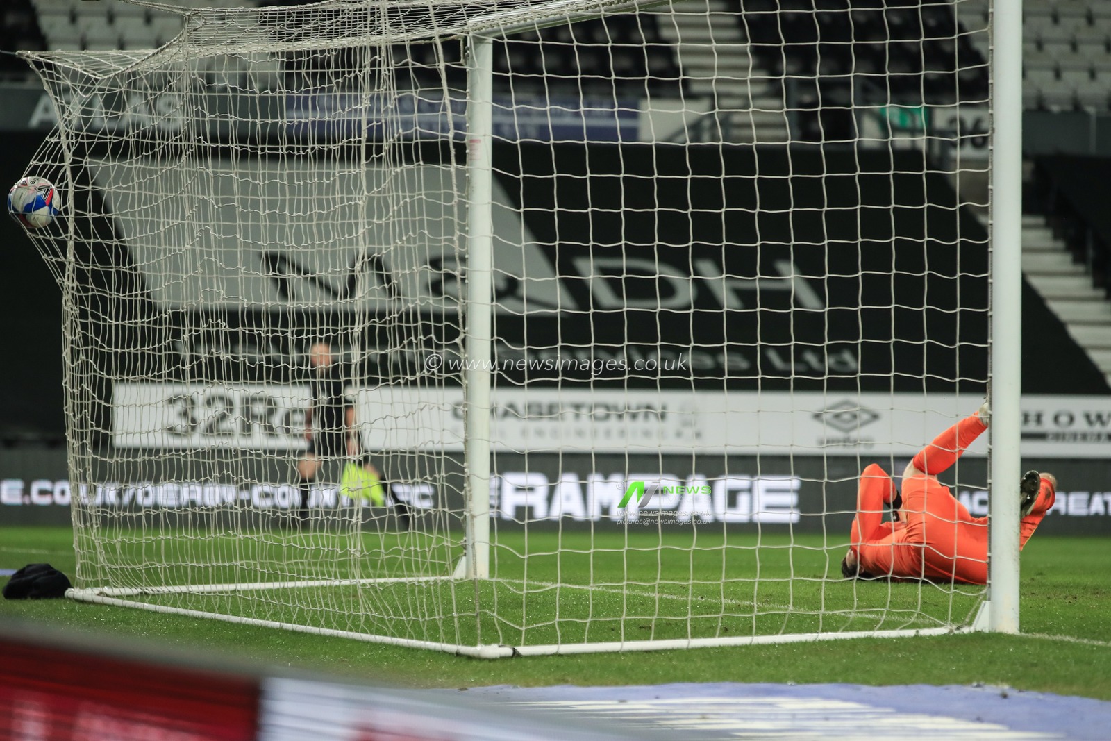 James Garner #37 of Nottingham Forest scores past Kelle Roos #21 of Derby County  to make it 0-1