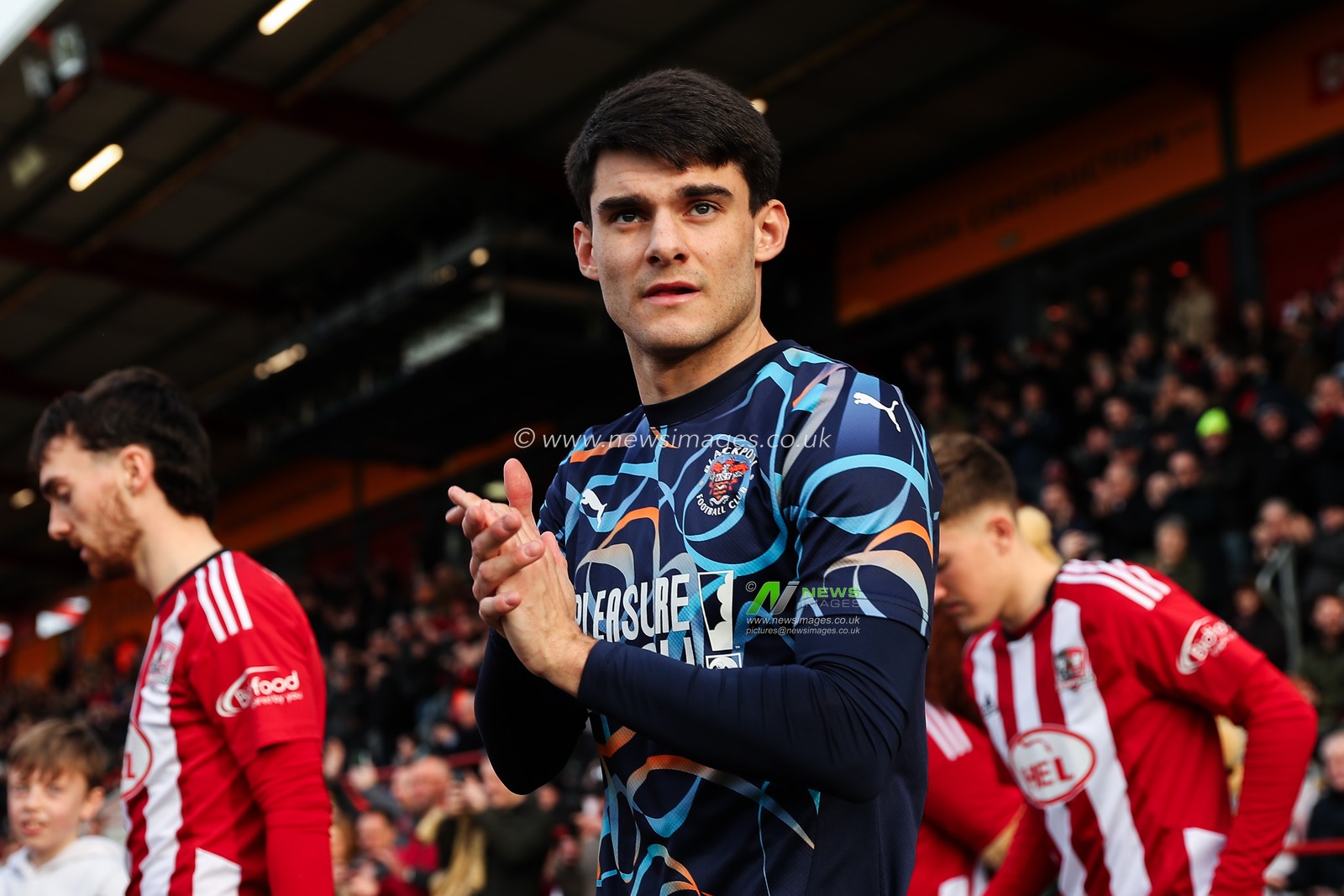 Rob Apter of Blackpool applauds the travelling fans during the Sky Bet League 1 match Exeter City vs Blackpool at St James' Park, Exeter, United Kingdom, 25th January 2025

(Photo by Gareth Evans/News Images)