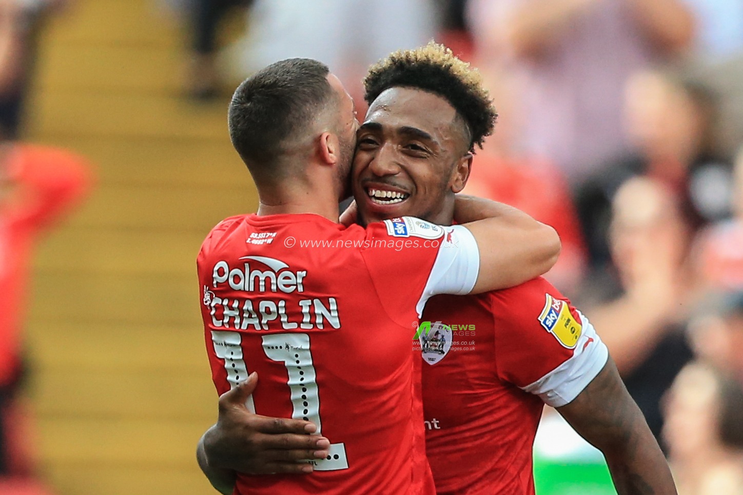 3rd August 2019, Oakwell, Barnsley, England; Sky Bet Championship, Barnsley vs Fulham ; Mallik Wilks (14) of Barnsley and Conor Chaplin (11) of Barnsley celebrate Barnsleyâ€™s 1-0 win 


Credit: Mark Cosgrove/News Images

English Football League images are subject to DataCo Licence