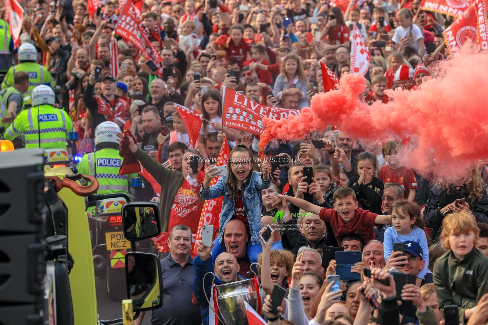 2nd June 2019 , Liverpool, England; UEFA Champions League, Liverpool FC Champions League winners celebrations and open top bus parade ; Liverpool fans line the streets to welcome home their heroes after winning the European Cup for the sixth time 

Credit: Mark Cosgrove/News Images