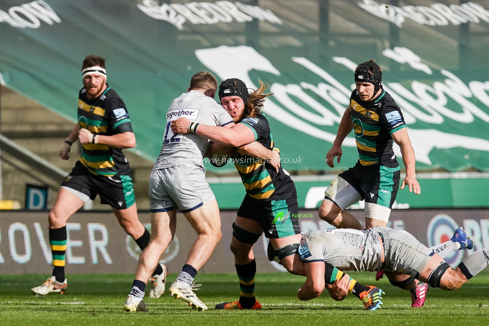 Alex Moon #4 of Northampton Saints runs into  Sam Hill #12 of Sale Sharks