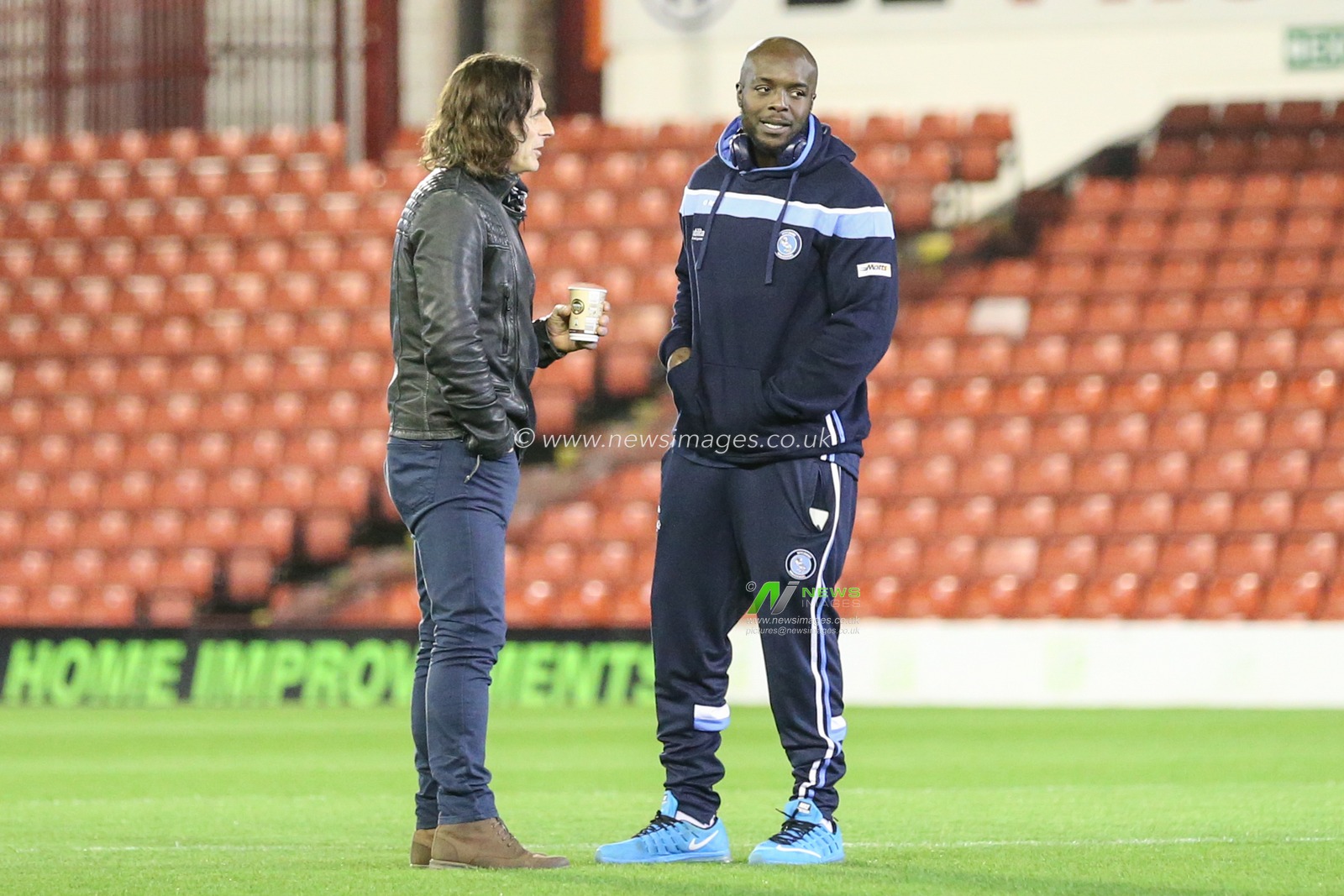 Gareth Ainsworth manager of Wycombe Wanderers and Adebayo Akinfenwa #20 of Wycombe Wanderers inspect the pitch before the game