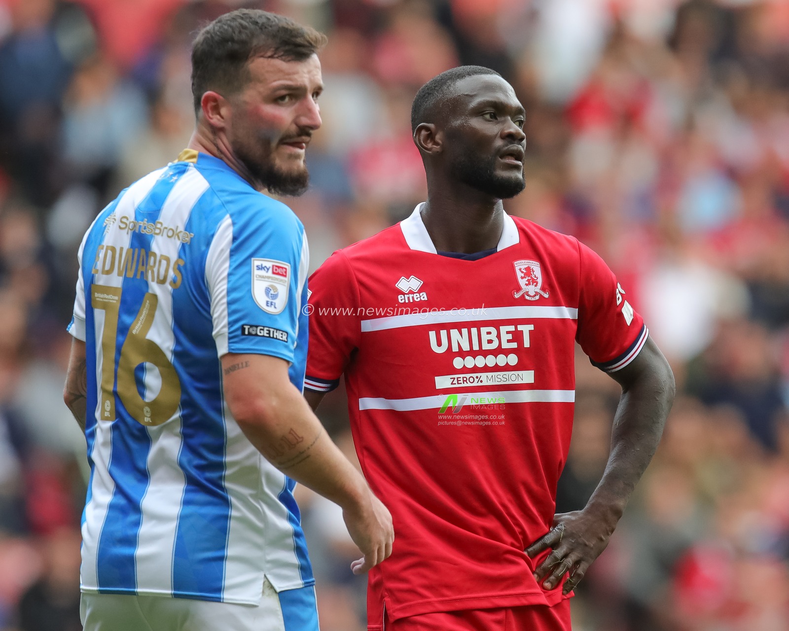 Emmanuel Latte Lath #9 of Middlesbrough and Tom Edwards #16 of Huddersfield Town during the Sky Bet Championship match Middlesbrough vs Huddersfield Town at Riverside Stadium, Middlesbrough, United Kingdom, 19th August 2023

(Photo by James Heaton/News Images)