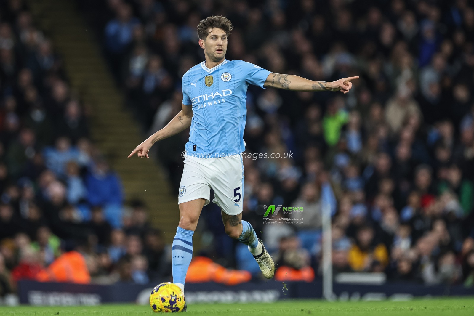John Stones of Manchester City breaks with the ball during the Premier League match Manchester City vs Brentford at Etihad Stadium, Manchester, United Kingdom, 20th February 2024

(Photo by Mark Cosgrove/News Images)