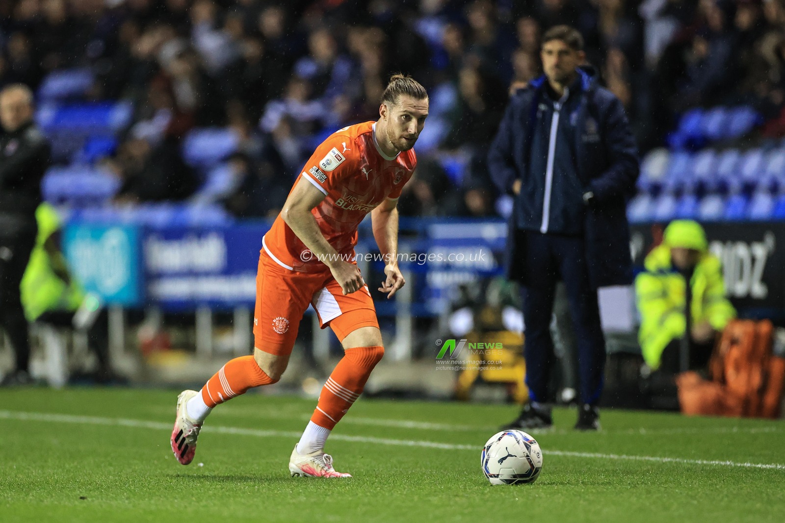 James Husband #3 of Blackpool breaks with the ball
