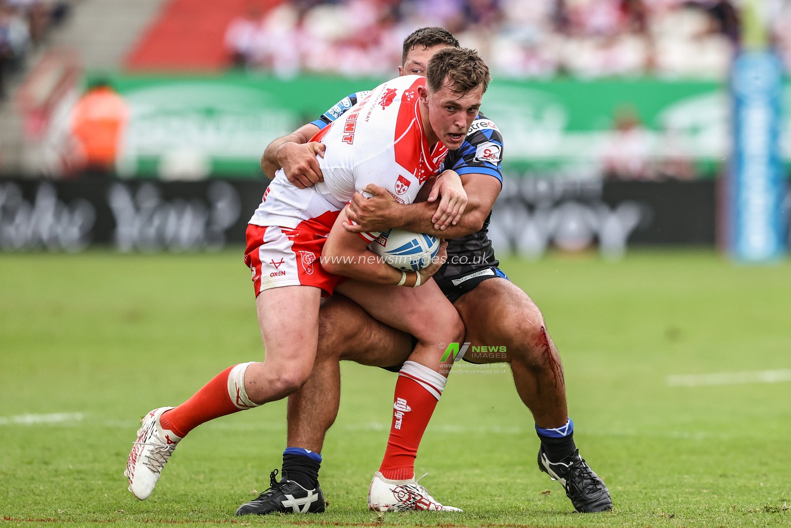 Jack Broadbent of Hull KR is tackled by Ryan Hall of Leeds Rhinos during the Betfred Super League round 17 match Hull KR vs Leeds Rhinos at Sewell Group Craven Park, Kingston upon Hull, United Kingdom, 6th July 2025

(Photo by Alfie Cosgrove/News Images)