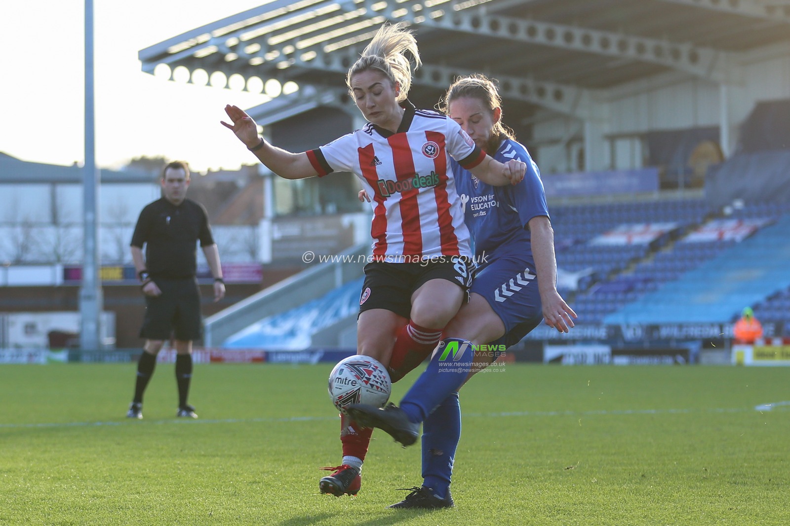 Sarah Robson #6 of Durham tackles Maddy Cusack #8 of Sheffield United