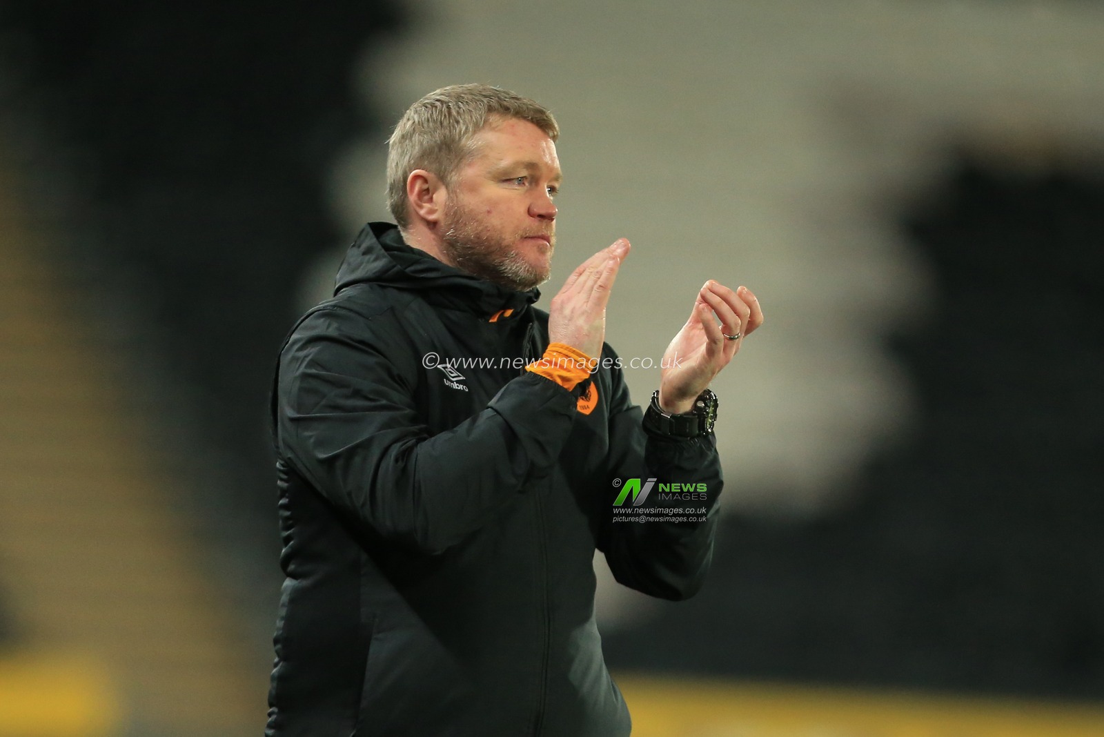 Grant McCann manager of Hull City applauds his players after going 3-0 up