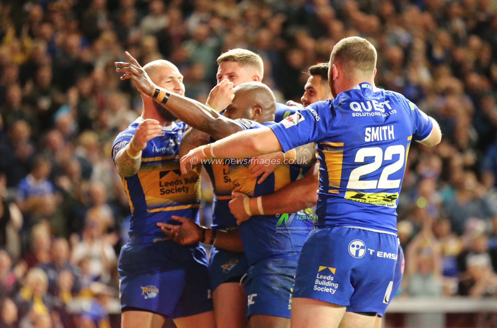 13th September 2019 , Emerald Headingley Stadium, England; Betfred Super League Rugby , Round 29, Leeds Rhinos vs Warrington Wolves ;  Robert Lui (40) celebrates scoring the 2nd try of the game for Leeds Rhinos alongside his team mates.

Credit: Steve Gaunt/News Images