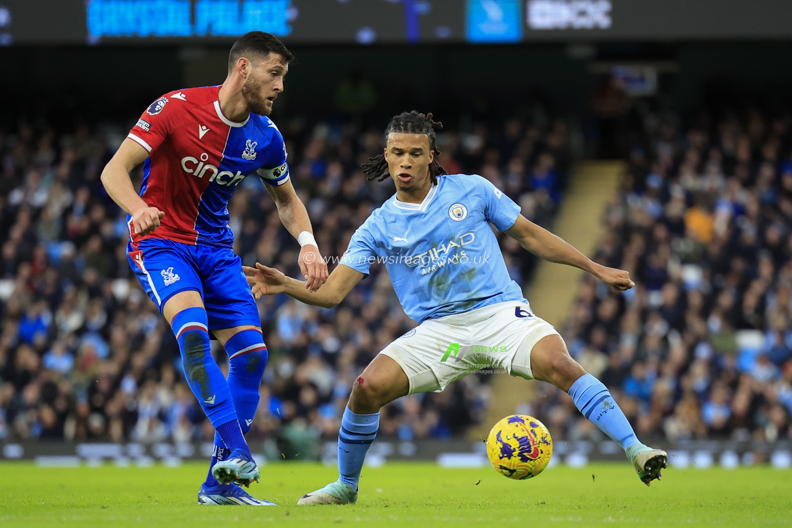 Joel Ward #2 of Crystal Palace passes the ball watched by Nathan Ake #6 of Manchester City during the Premier League match Manchester City vs Crystal Palace at Etihad Stadium, Manchester, United Kingdom, 16th December 2023

(Photo by Conor Molloy/News Images)