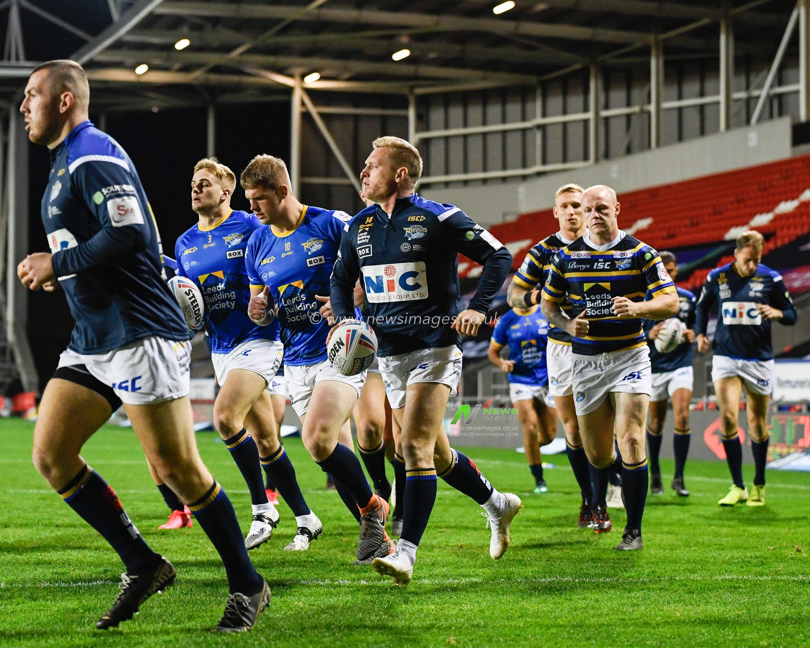 The Leeds Rhinoâ€™s players begin their warm up