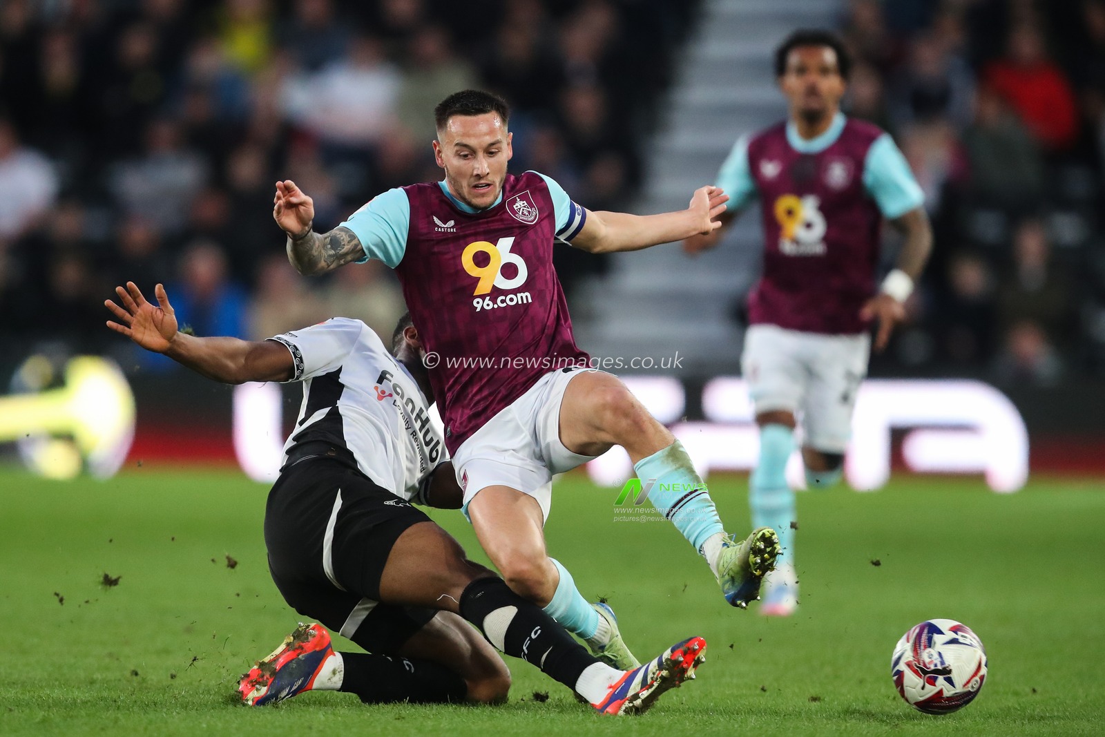 Ebou Adams of Derby County tackles Josh Brownhill of Burnley during the Sky Bet Championship match Derby County vs Burnley at Pride Park Stadium, Derby, United Kingdom, 8th April 2025

(Photo by Gareth Evans/News Images)