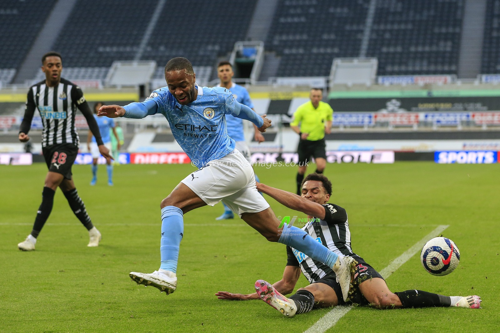 Jacob Murphy #23 of Newcastle United tackles Raheem Sterling #7 of Manchester City