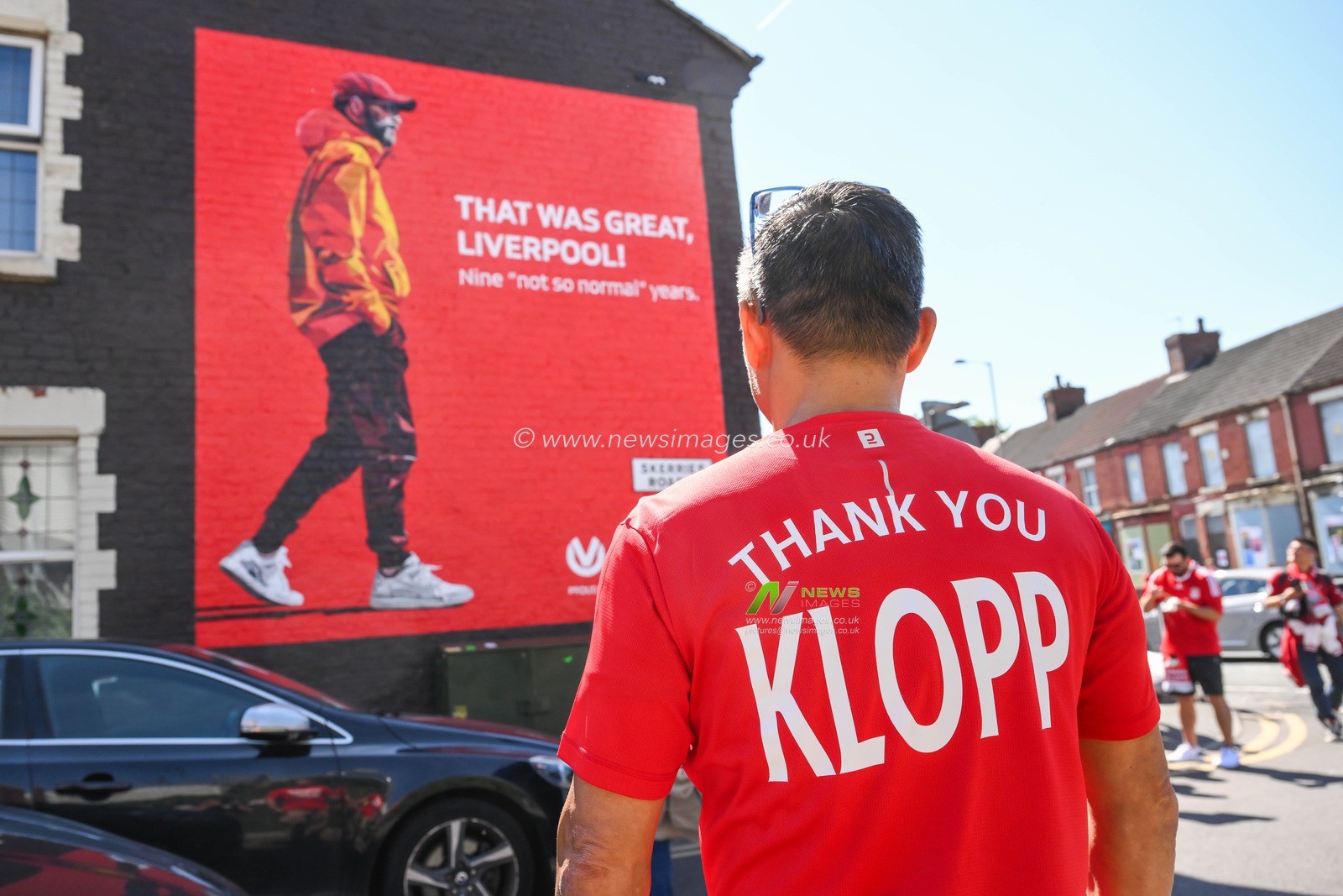 A fan with Thank you Klopp looks at the JÃ¼rgen Klopp Manager goodbye mural outside of Anfield ahead of the Premier League match Liverpool vs Wolverhampton Wanderers at Anfield, Liverpool, United Kingdom, 19th May 2024

(Photo by Craig Thomas/News Images)