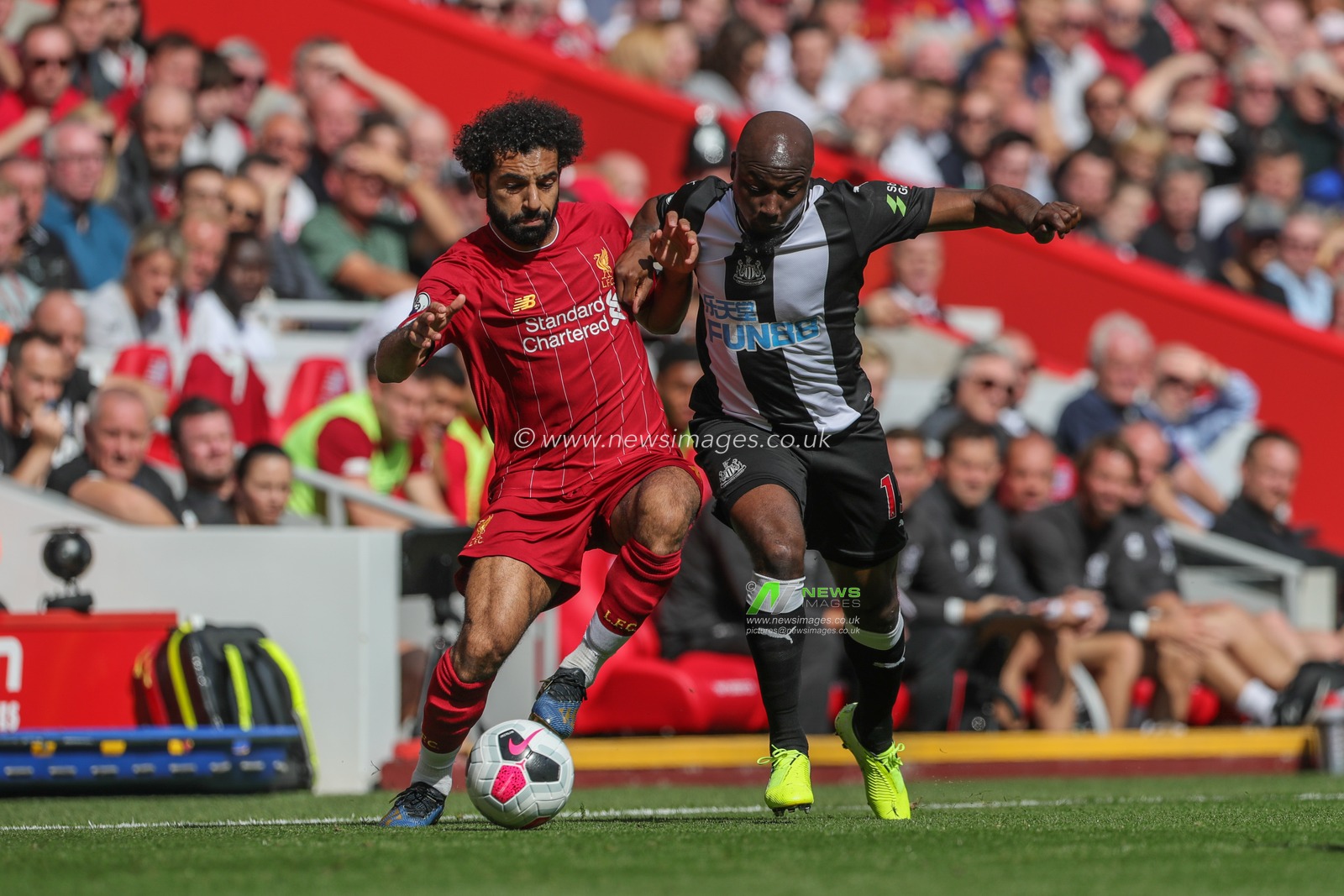 14th September 2019 , Anfield, Liverpool, England; Premier League Football, Liverpool vs Newcastle United ; Mohamed Salah (11) of Liverpool in action during the game as Jetro Willems (15) of Newcastle United challenges 


Credit: Mark Cosgrove/News Images 


Premier League/EFL Football images are subject to DataCo Licence