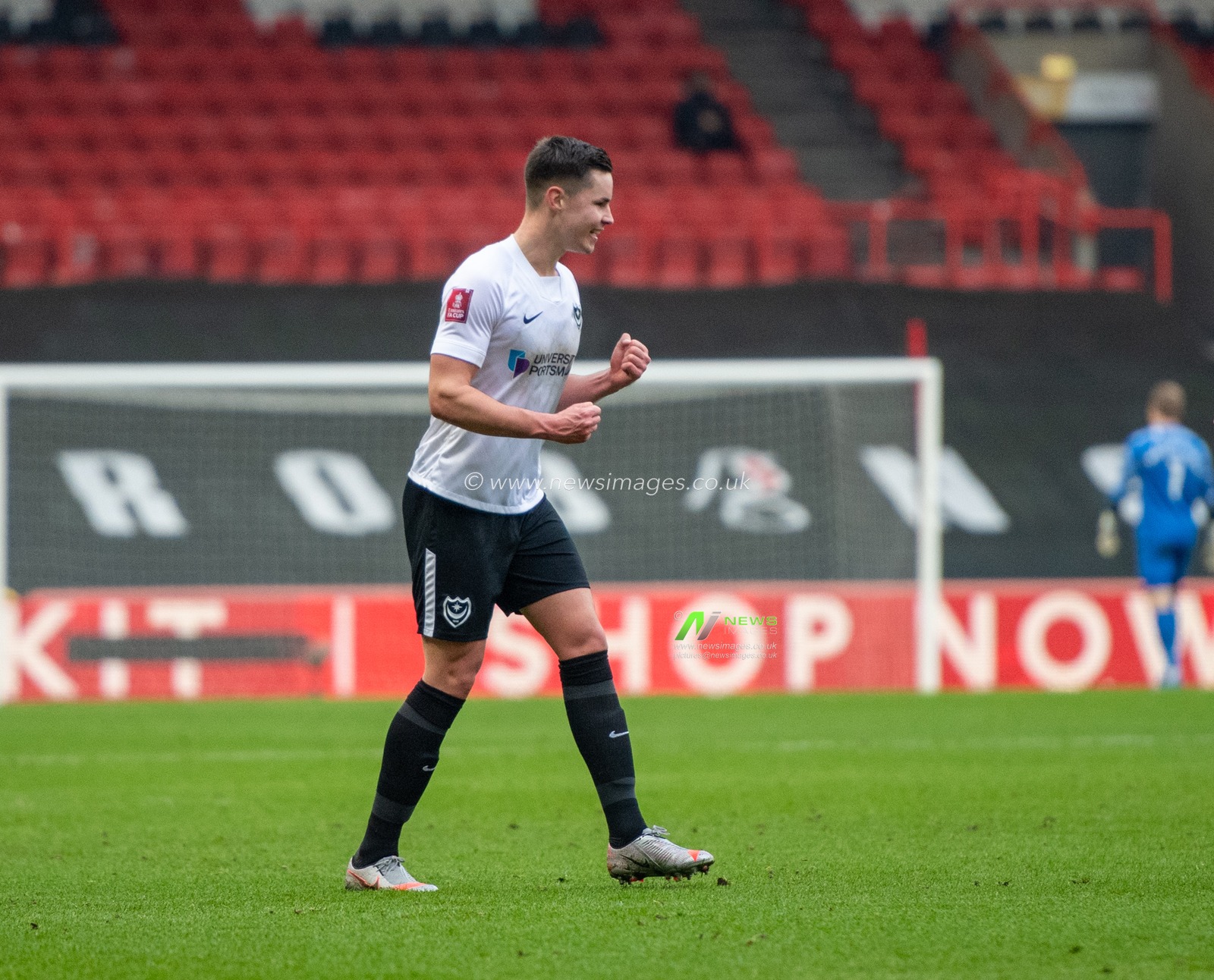 Callum Johnson #2 of Portsmouth celebrates his goal