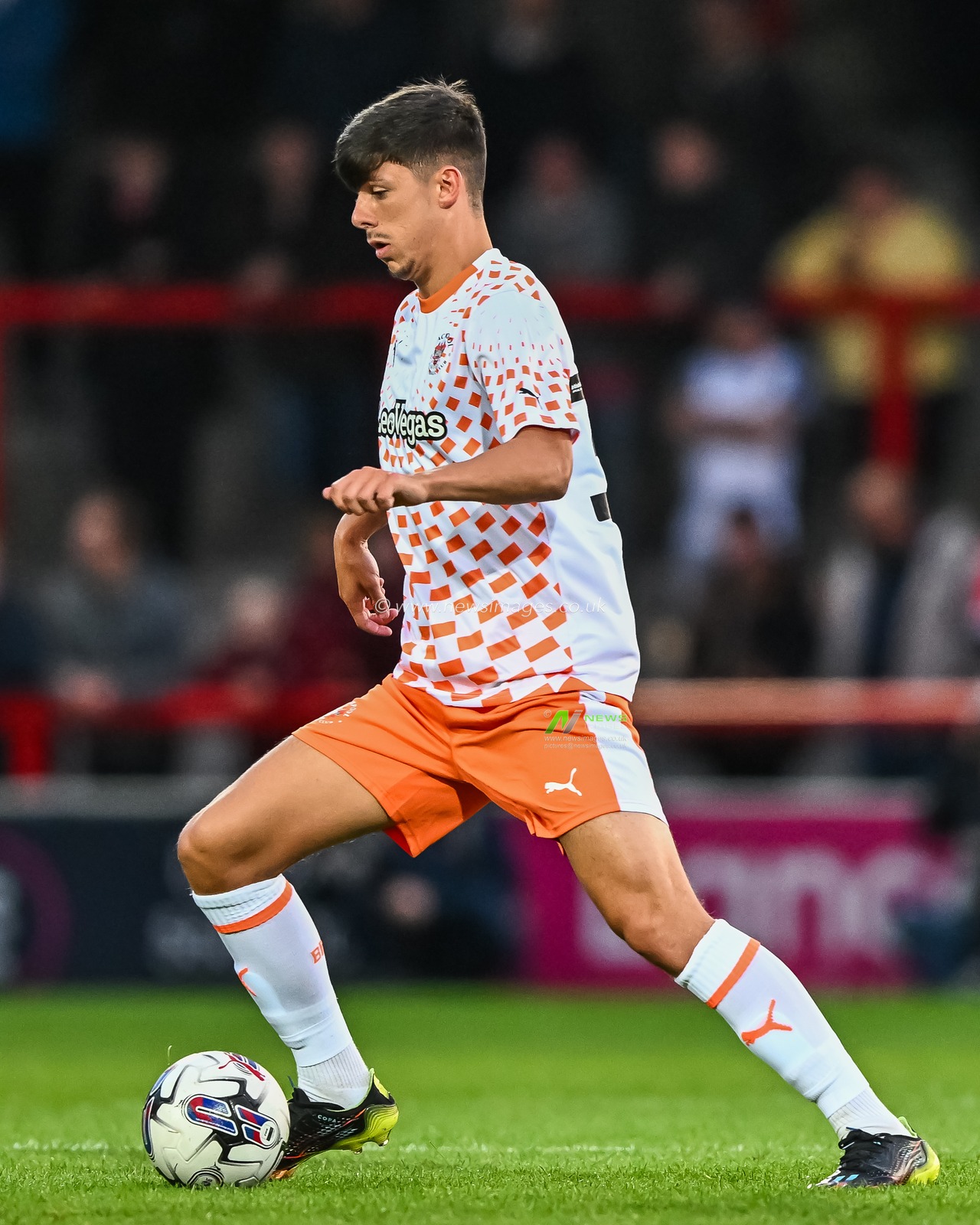 Luke Mariette #37 of Blackpool makes a break with the ball  during the Pre-season friendly match Morecambe vs Blackpool at Mazuma Stadium, Morecambe, United Kingdom, 25th July 2023

(Photo by Craig Thomas/News Images)