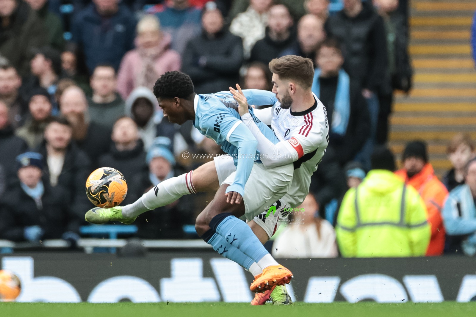 \m65\and Luke Garbutt of Salford City battle for the ball during the Emirates FA Cup 4th Round match Manchester City vs Salford City at Etihad Stadium, Manchester, United Kingdom on 14 February 2026

(Photo by Mark Cosgrove/News Images)