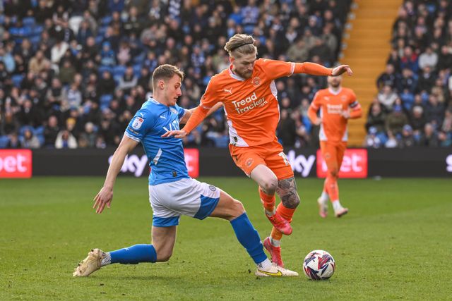 Hayden Coulson of Blackpool skips past the tackle of Owen Moxon of Stockport County during the Sky Bet League 1 match Stockport County vs Blackpool at Edgeley Park Stadium, Stockport, United Kingdom, 1st March 2025

(Photo by Craig Thomas/News Images)