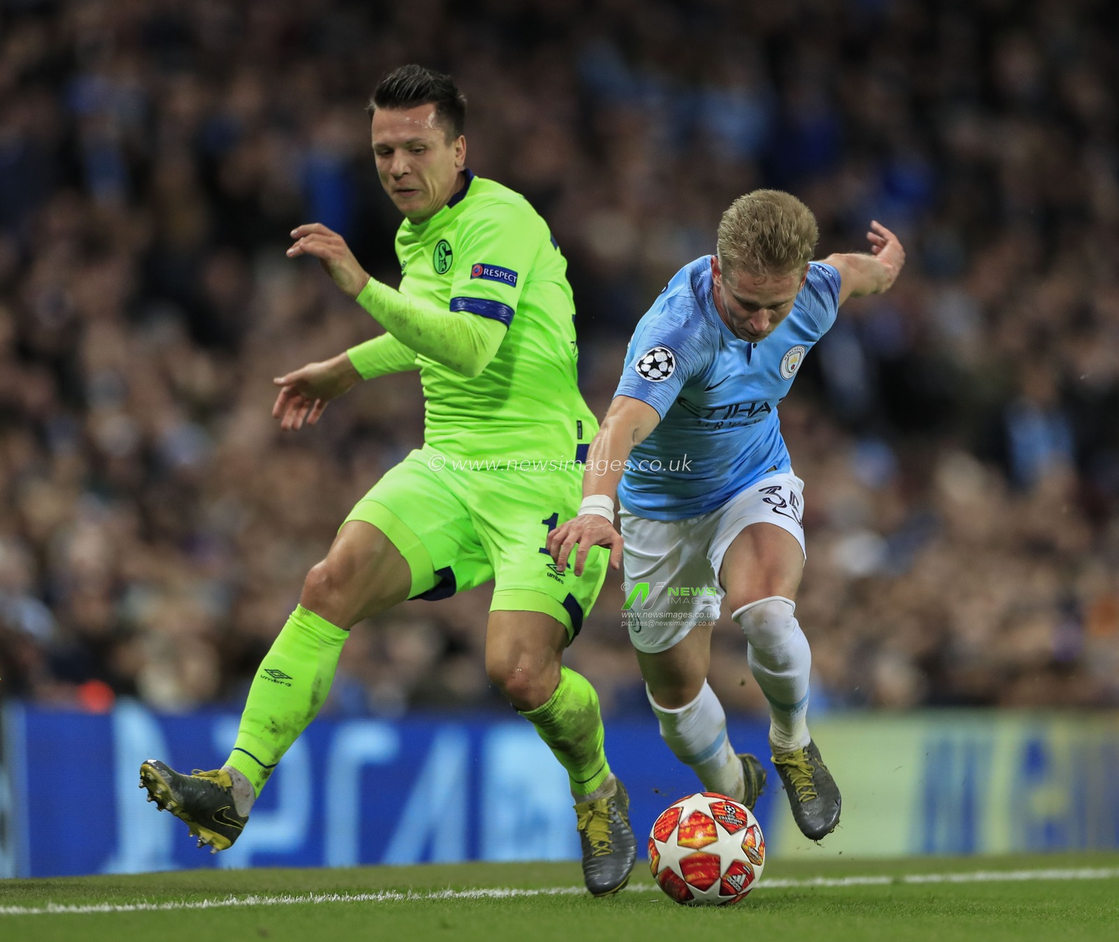 12th March 2019 , Etihad Stadium, Manchester, England; UEFA Champions League, Round of 16, Manchester City v Schalke ; Yevhen Konoplyanka (11) of FC Schalke and Oleksandr Zinchenko (35) of Manchester City challenge for the ball

Credit: Conor Molloy/News Images