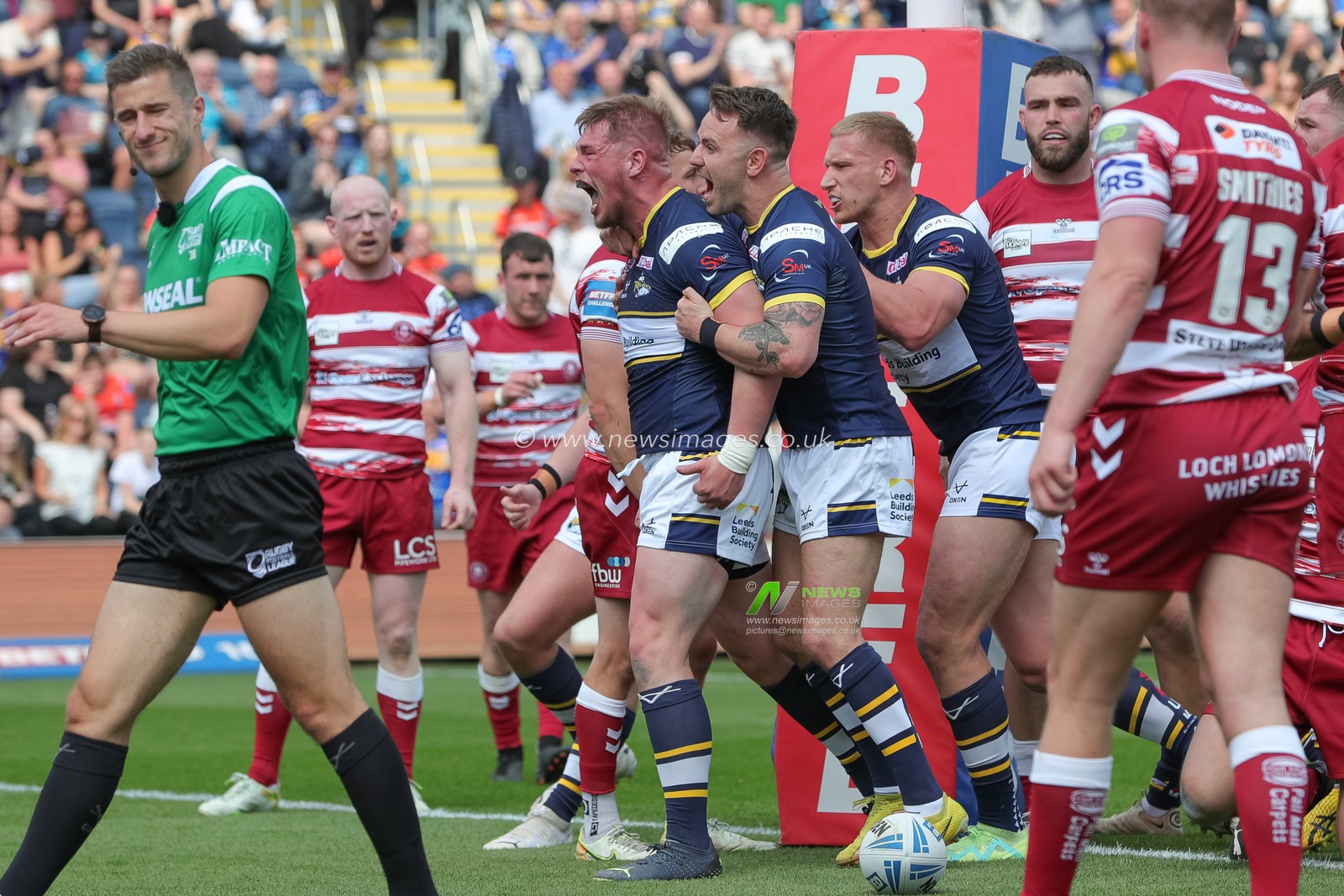 Tom Holroyd #18 of Leeds Rhinos celebrates his try and makes the score 4-0 in the first half of the Betfred Challenge Cup match Leeds Rhinos vs Wigan Warriors at Headingley Stadium, Leeds, United Kingdom, 20th May 2023

(Photo by James Heaton/News Images)