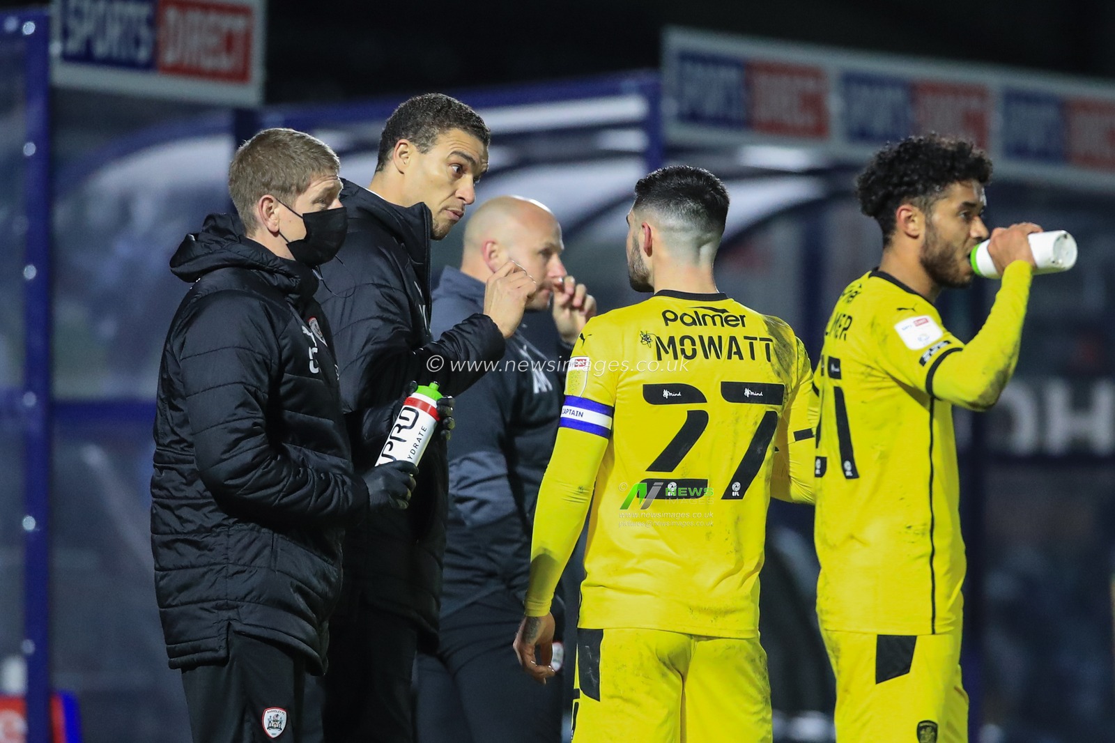 ValÃ©rien IsmaÃ«l manager of Barnsley gives Alex Mowatt #27 of Barnsley instructions