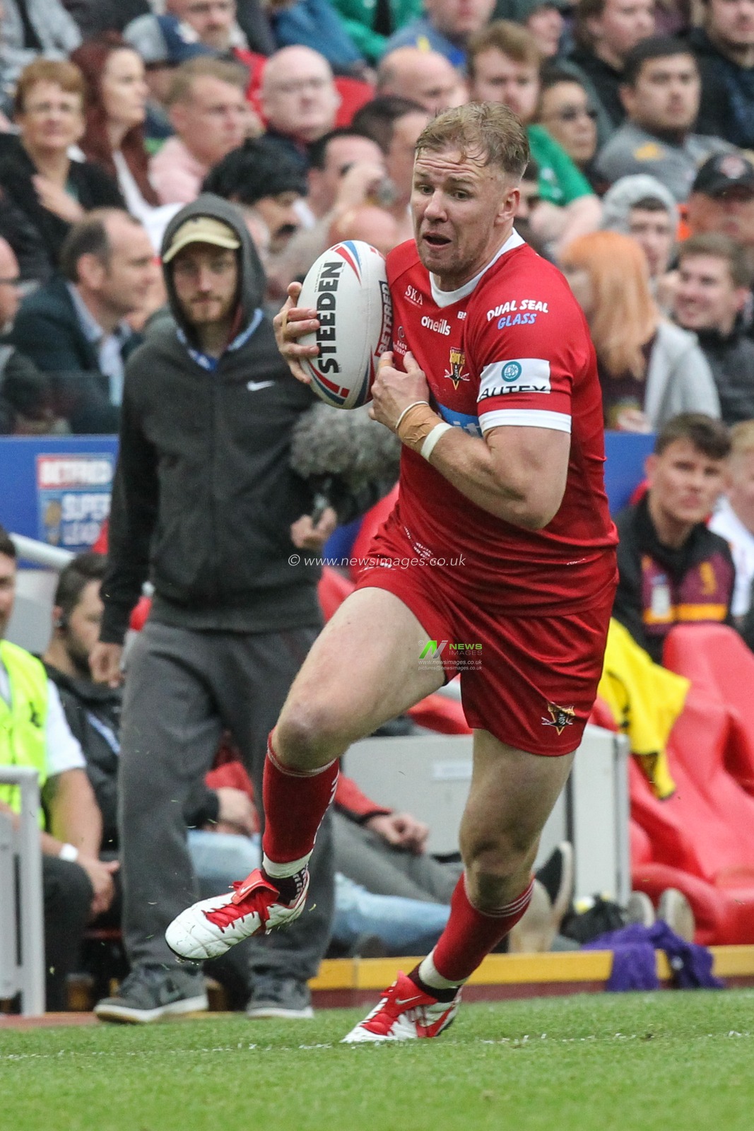 25th May 2019 , Anfield Stadium, Liverpool, England; Dacia Magic Weekend, Betfred Super League Round 16, Hull FC vs Huddersfield Giants ; Aaron Murphy (11) of Huddersfield Giants runs with the ball

Credit: David Greaves/News Images