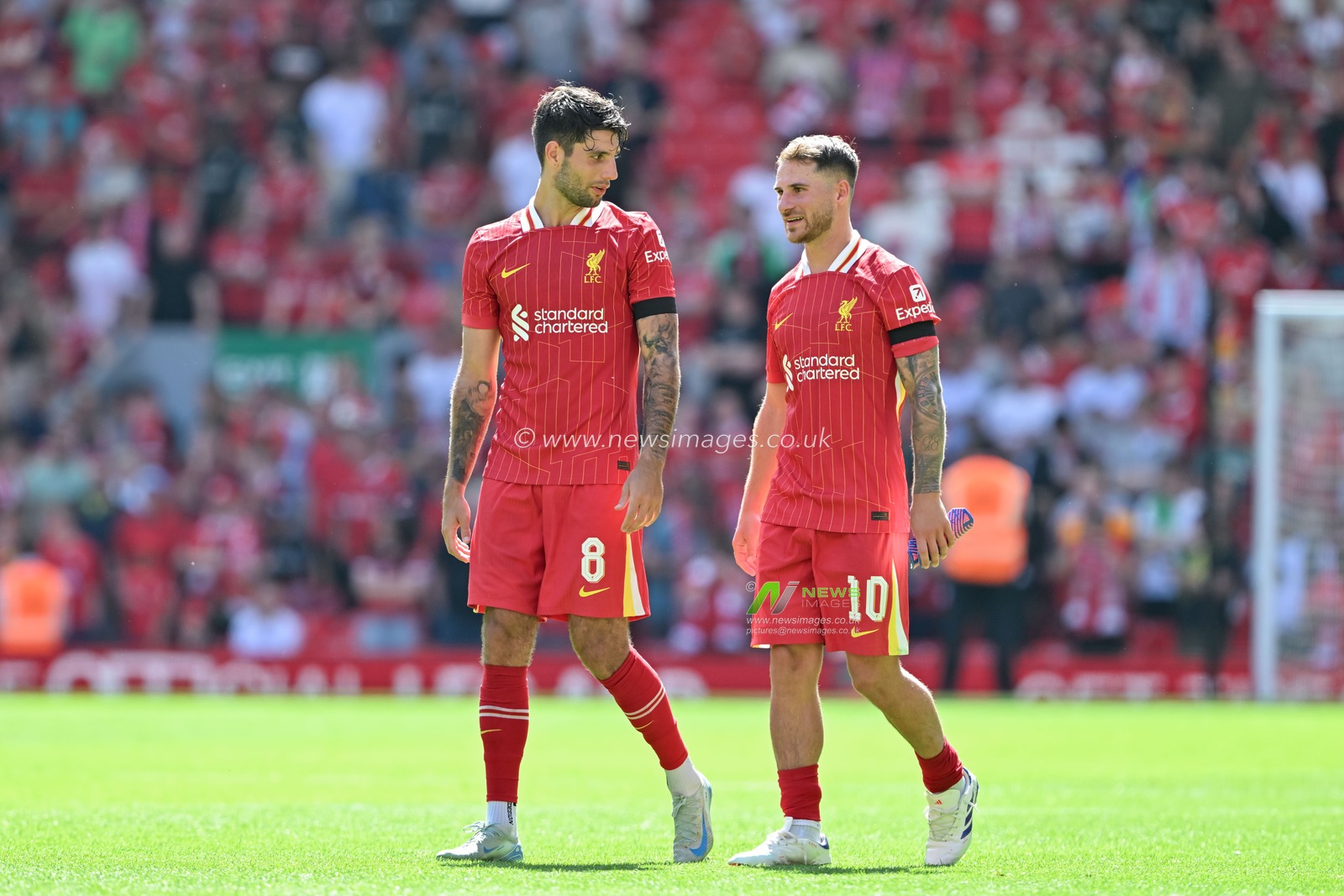 Dominik Szoboszlai of Liverpool speaks with Alexis Mac Allister of Liverpool at full time during the Pre-season friendly match Liverpool vs Sevilla at Anfield, Liverpool, United Kingdom, 11th August 2024

(Photo by Cody Froggatt/News Images)
