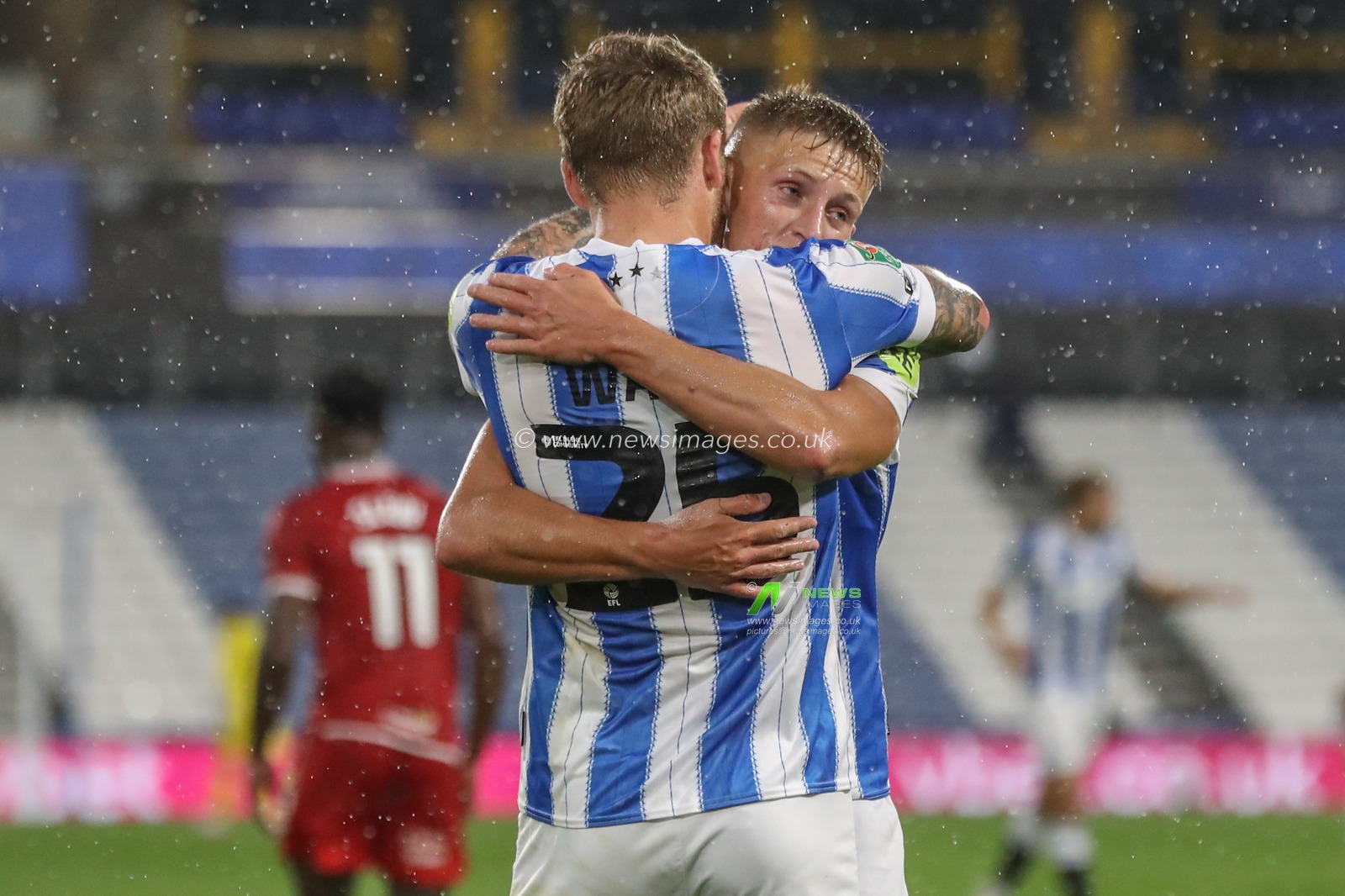 Danny Ward of Huddersfield Town celebrates his goal to make it 3-0 during the Carabao Cup match Huddersfield Town vs Morecambe at John Smith's Stadium, Huddersfield, United Kingdom, 13th August 2024

(Photo by Alfie Cosgrove/News Images)