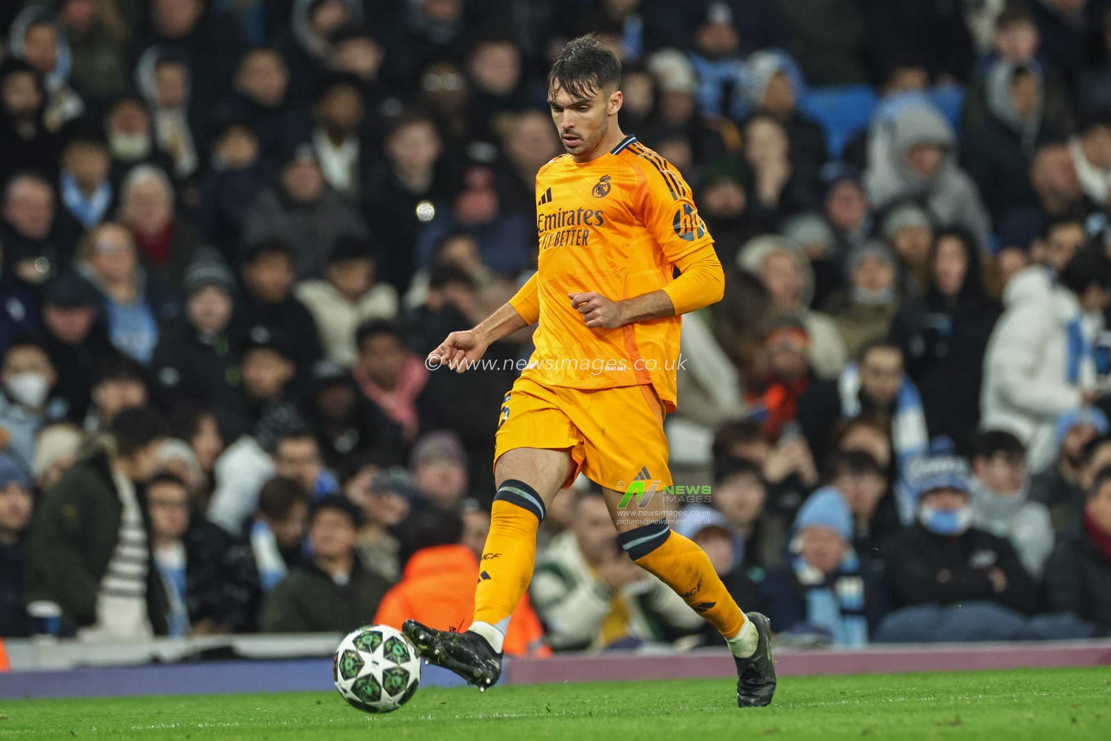 RaÃºl Asencio of Real Madrid passes the ball during the UEFA Champions League Knockout Round Play-off Manchester City v Real Madrid at Etihad Stadium, Manchester, United Kingdom, 11th February 2025

(Photo by Mark Cosgrove/News Images)