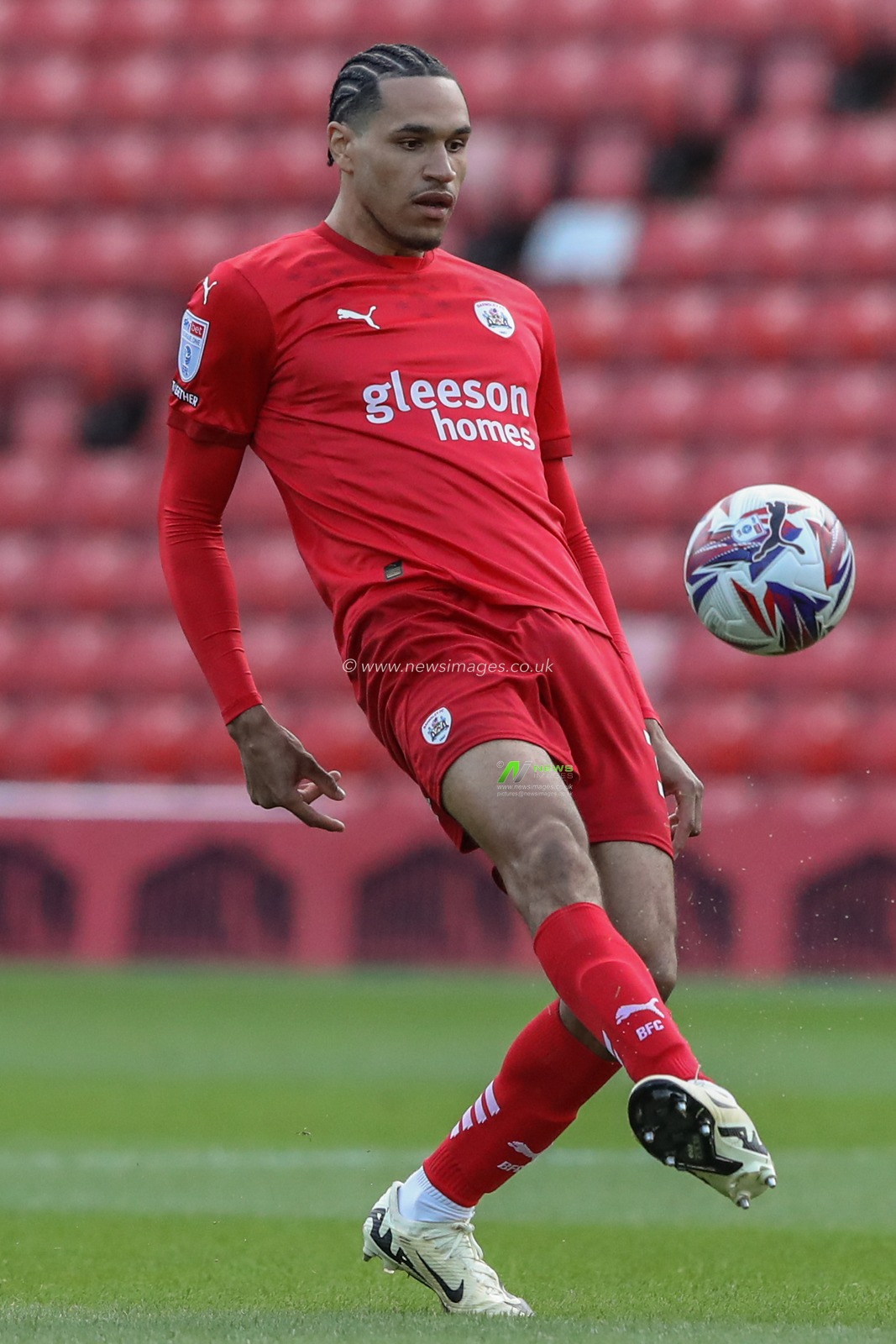 Jon Russell of Barnsley in action during the Bristol Street Motors Trophy match Barnsley vs Manchester United U21 at Oakwell, Barnsley, United Kingdom, 20th August 2024

(Photo by Alfie Cosgrove/News Images)