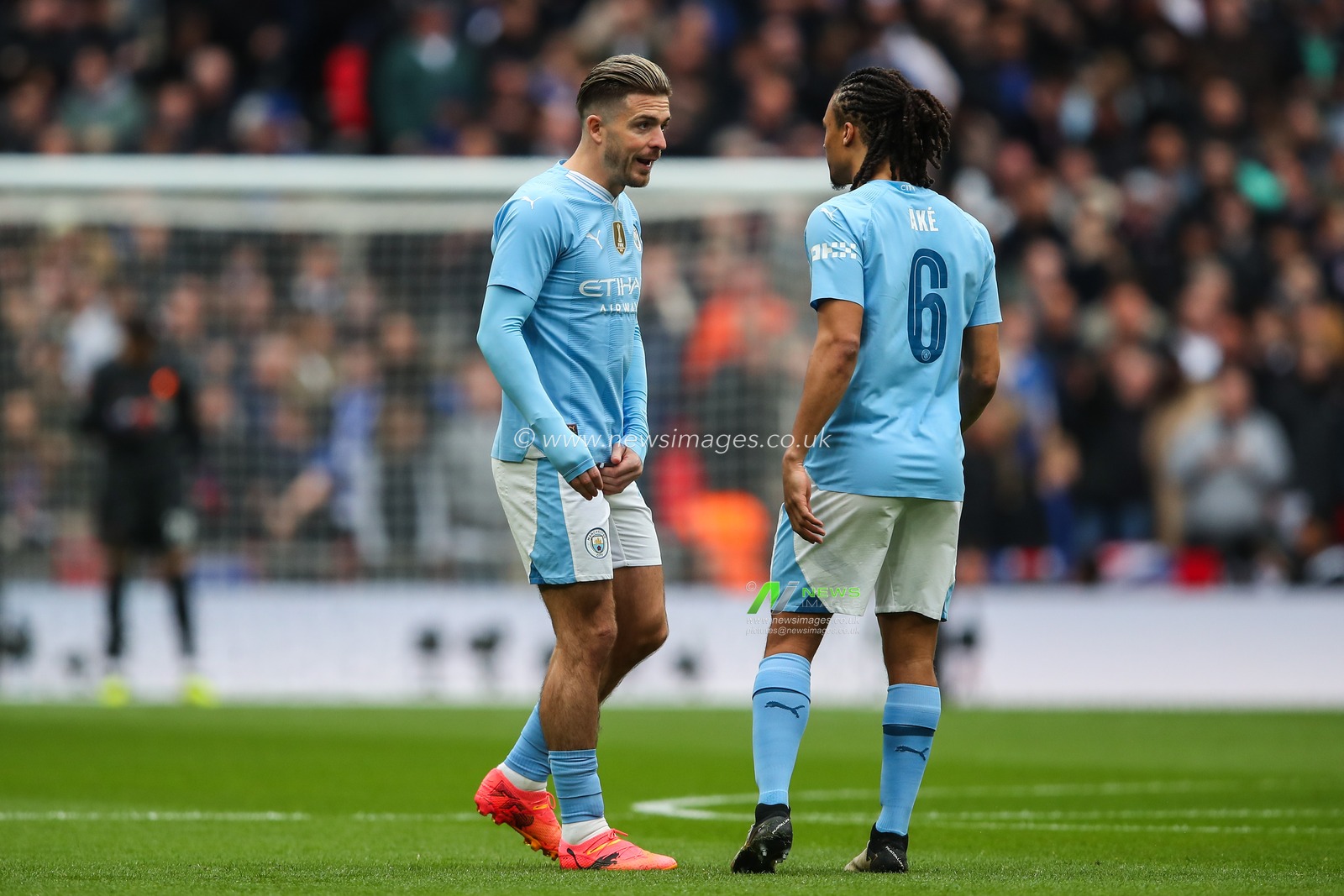 Jack Grealish of Manchester City talks to Nathan AkÃ© of Manchester City during the Emirates FA Cup Semi-Final match Manchester City vs Chelsea at Wembley Stadium, London, United Kingdom, 20th April 2024

(Photo by Gareth Evans/News Images)