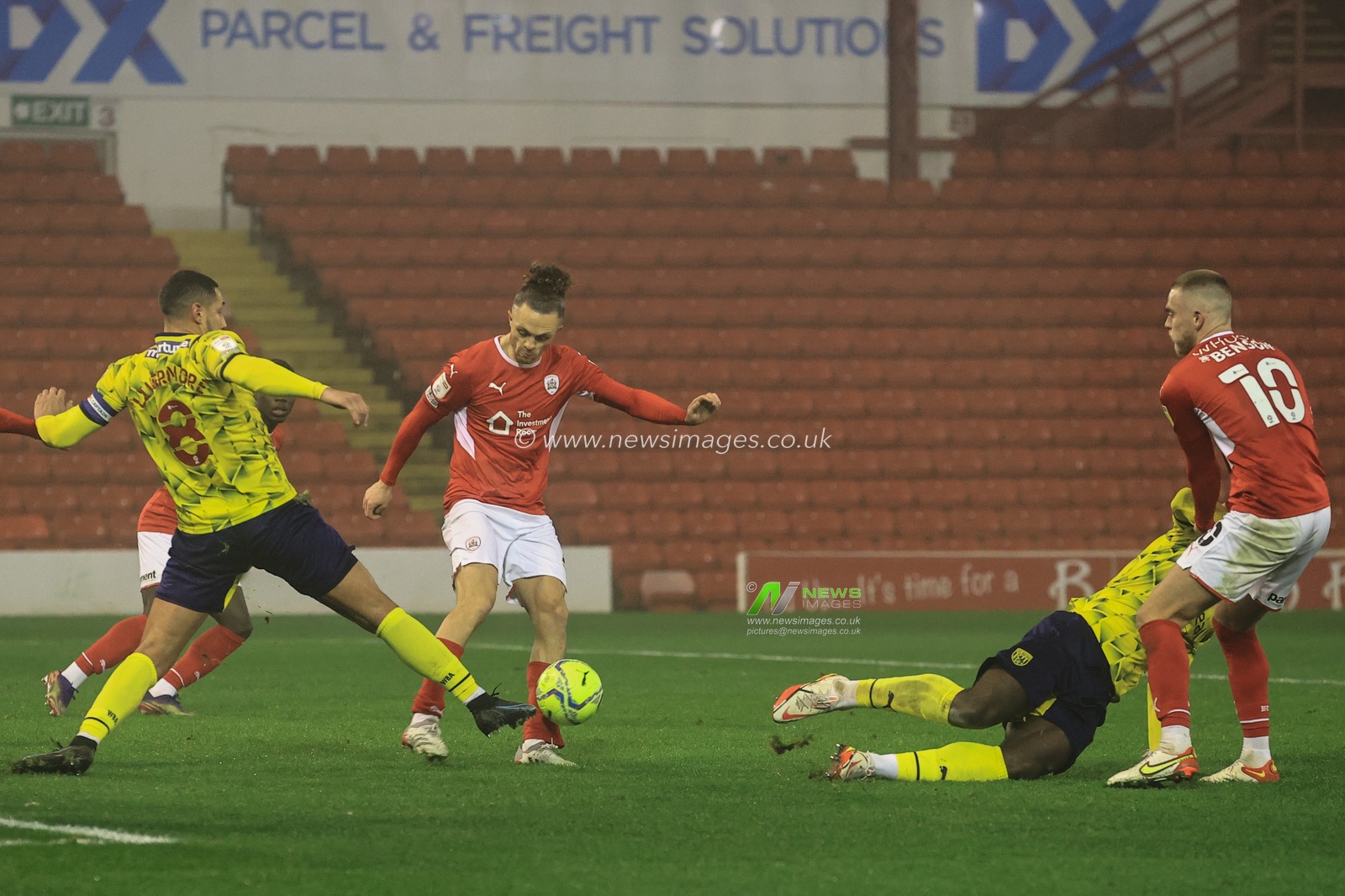 Jordan Williams #2 of Barnsley clears the ball