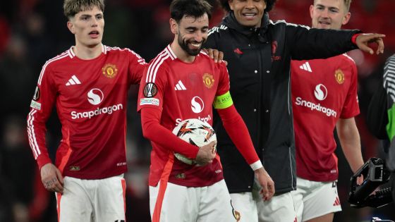 Bruno Fernandes of Manchester United collects the match ball after scoring a hat-trick during the UEFA Europa League Last 16 match Manchester United vs Real Sociedad at Old Trafford, Manchester, United Kingdom, 13th March 2025  (Photo by Craig Thomas/News Images)
